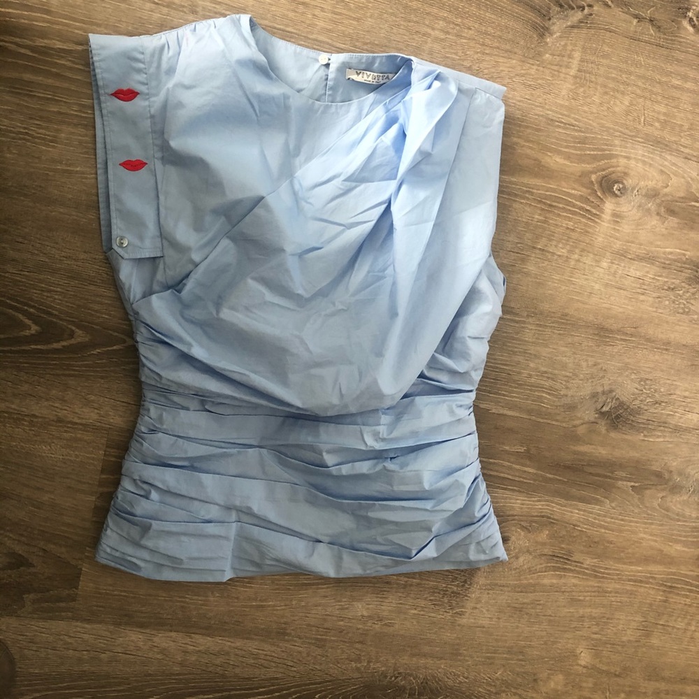Vivetta light blue top w/ gathers and red lips. 46